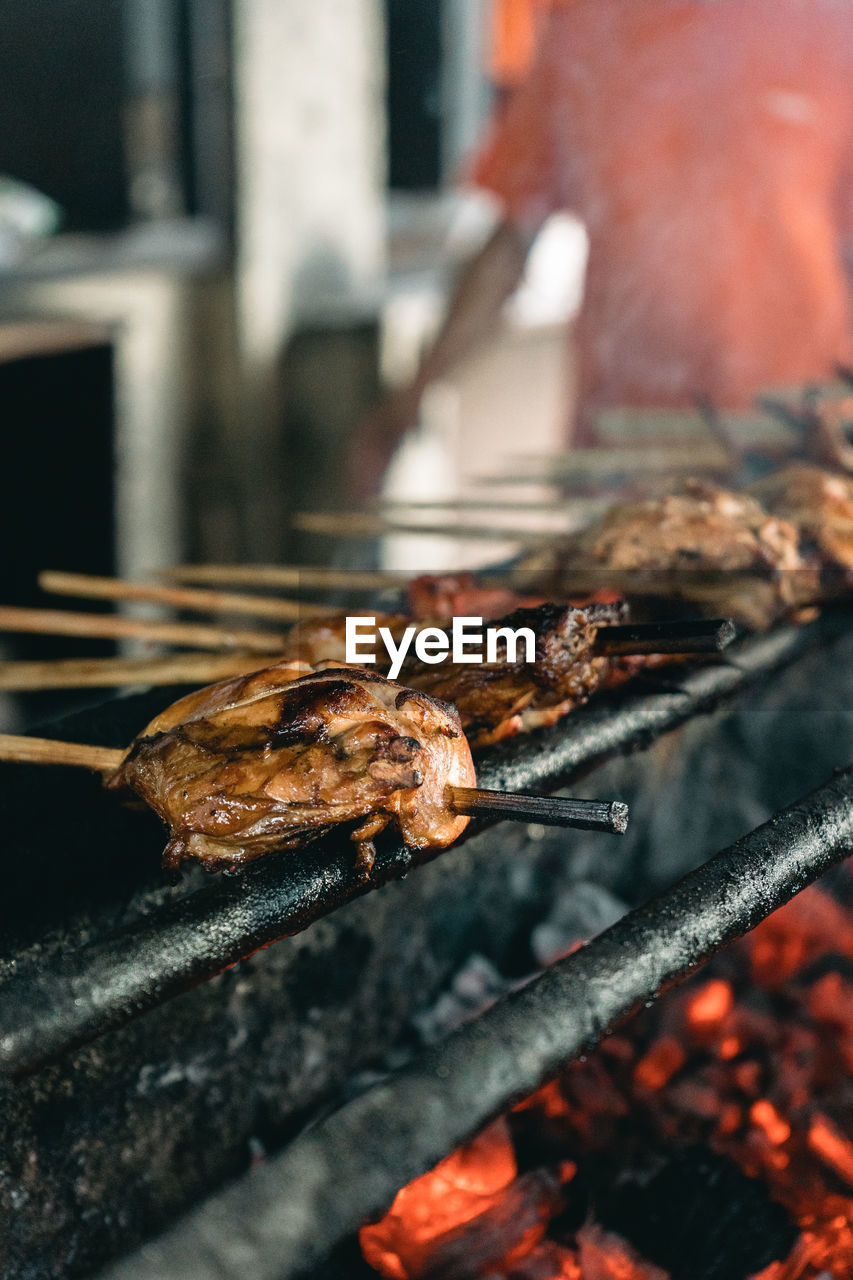 Close-up of meat on barbecue grill