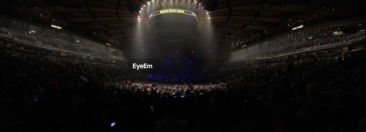 AERIAL VIEW OF ILLUMINATED STAGE AT CONCERT