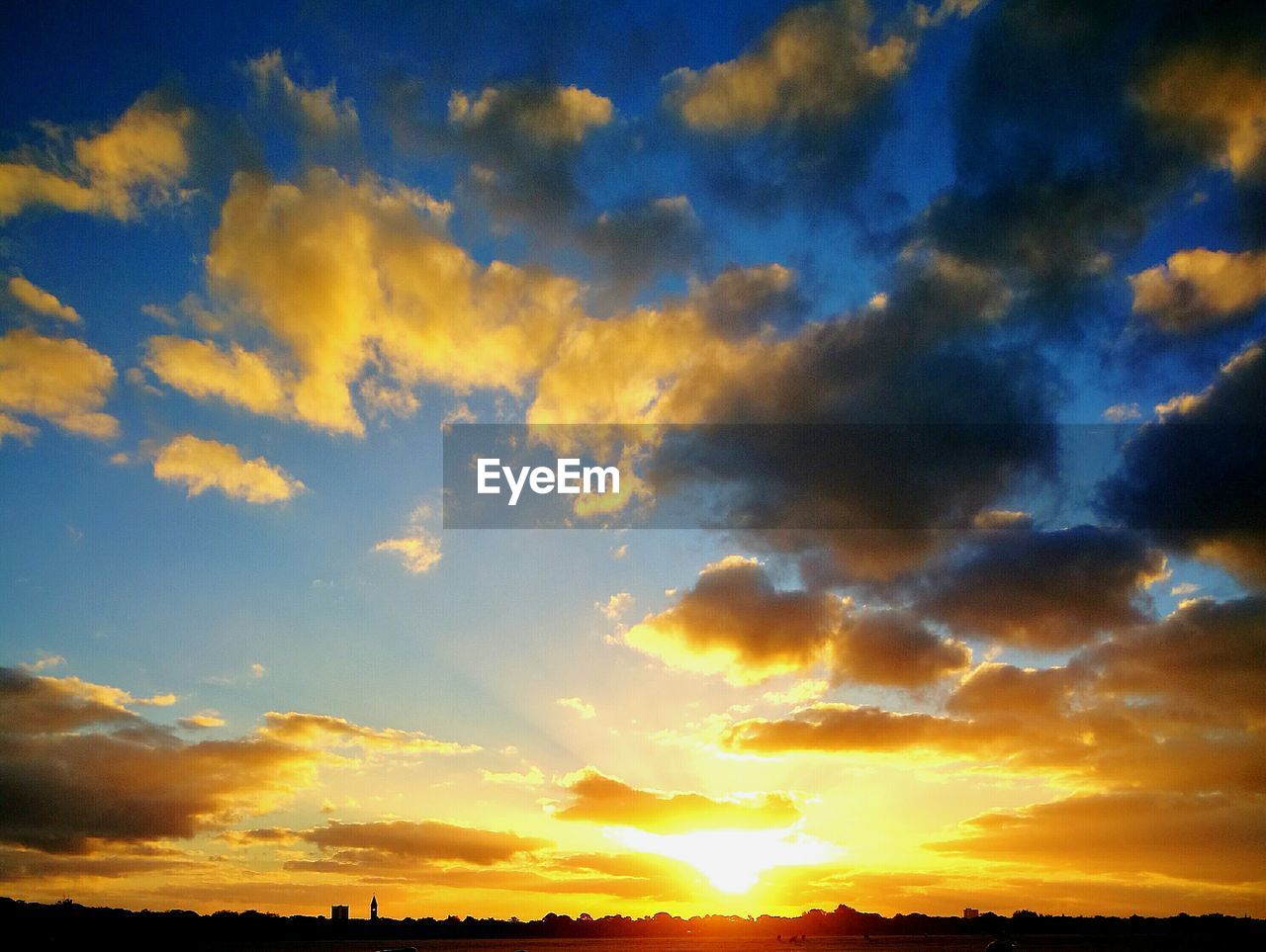 SCENIC VIEW OF DRAMATIC SKY DURING SUNSET