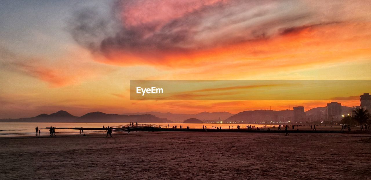 Scenic view of sea against romantic sky at sunset