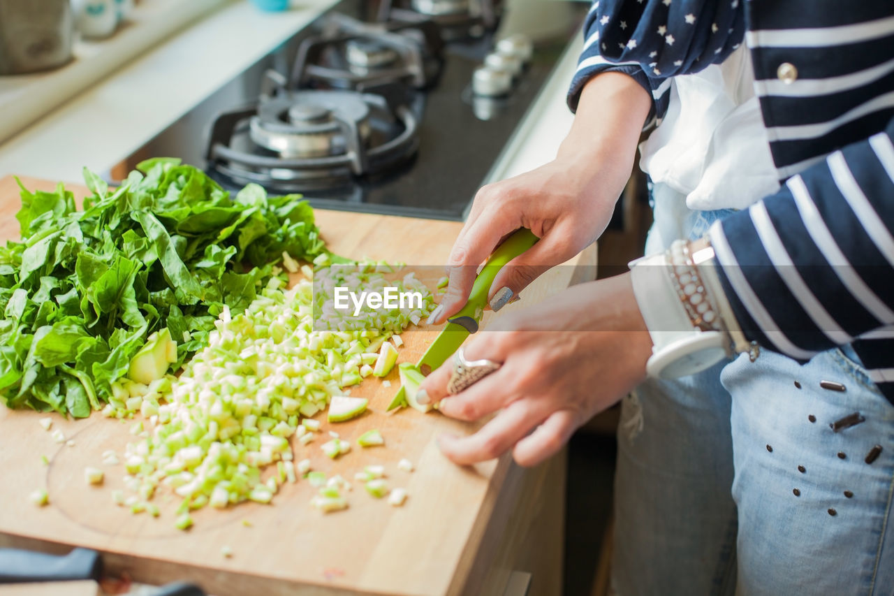 Midsection of woman preparing food