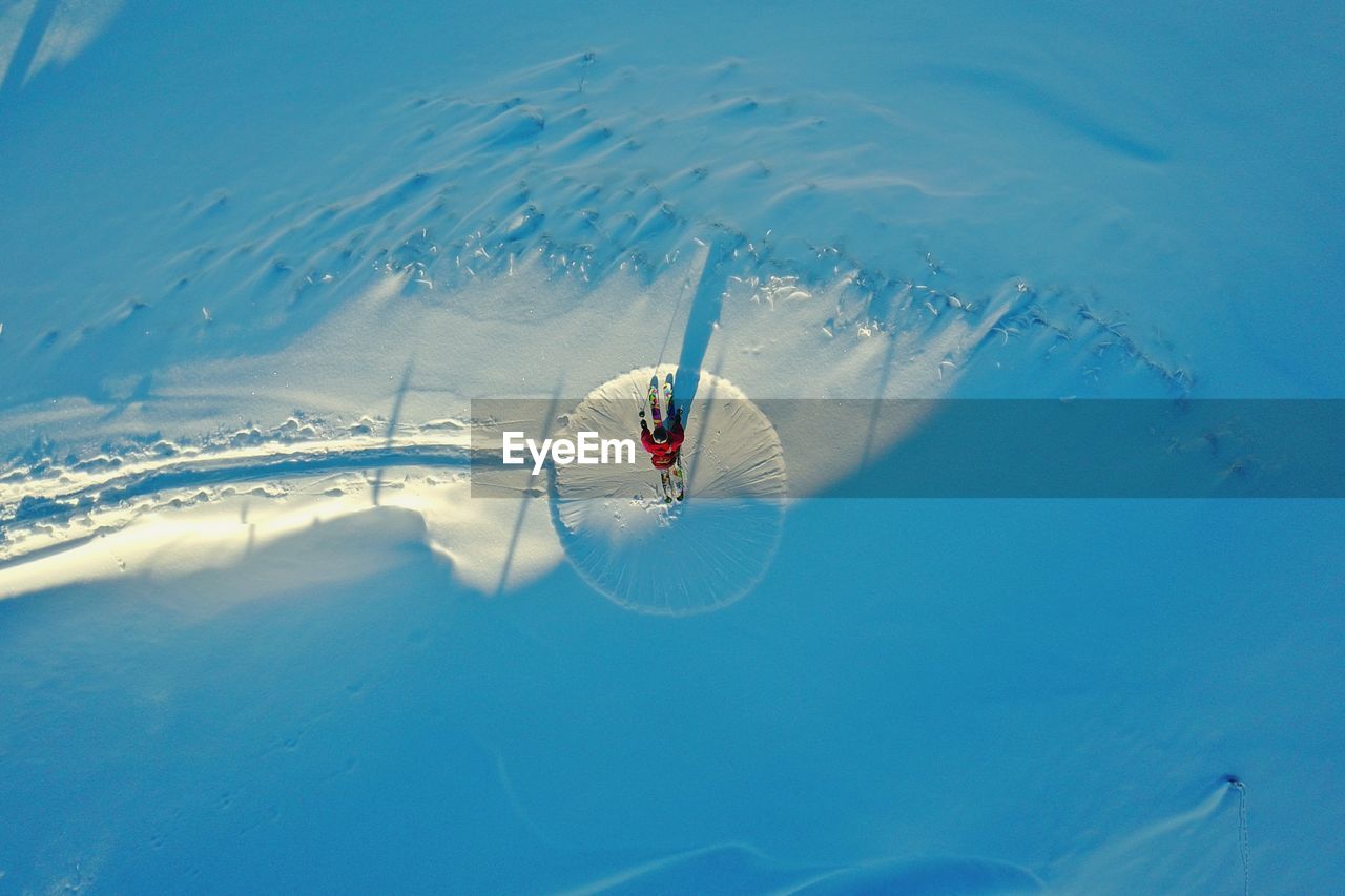 Directly above shot of person skiing on snowy mountain