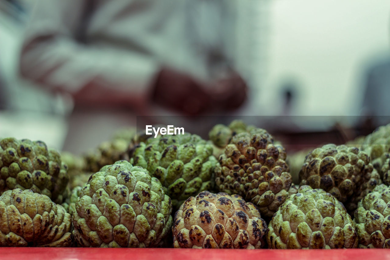 Stacks of sugar apple or custard apple at the traditional marketplace in delhi