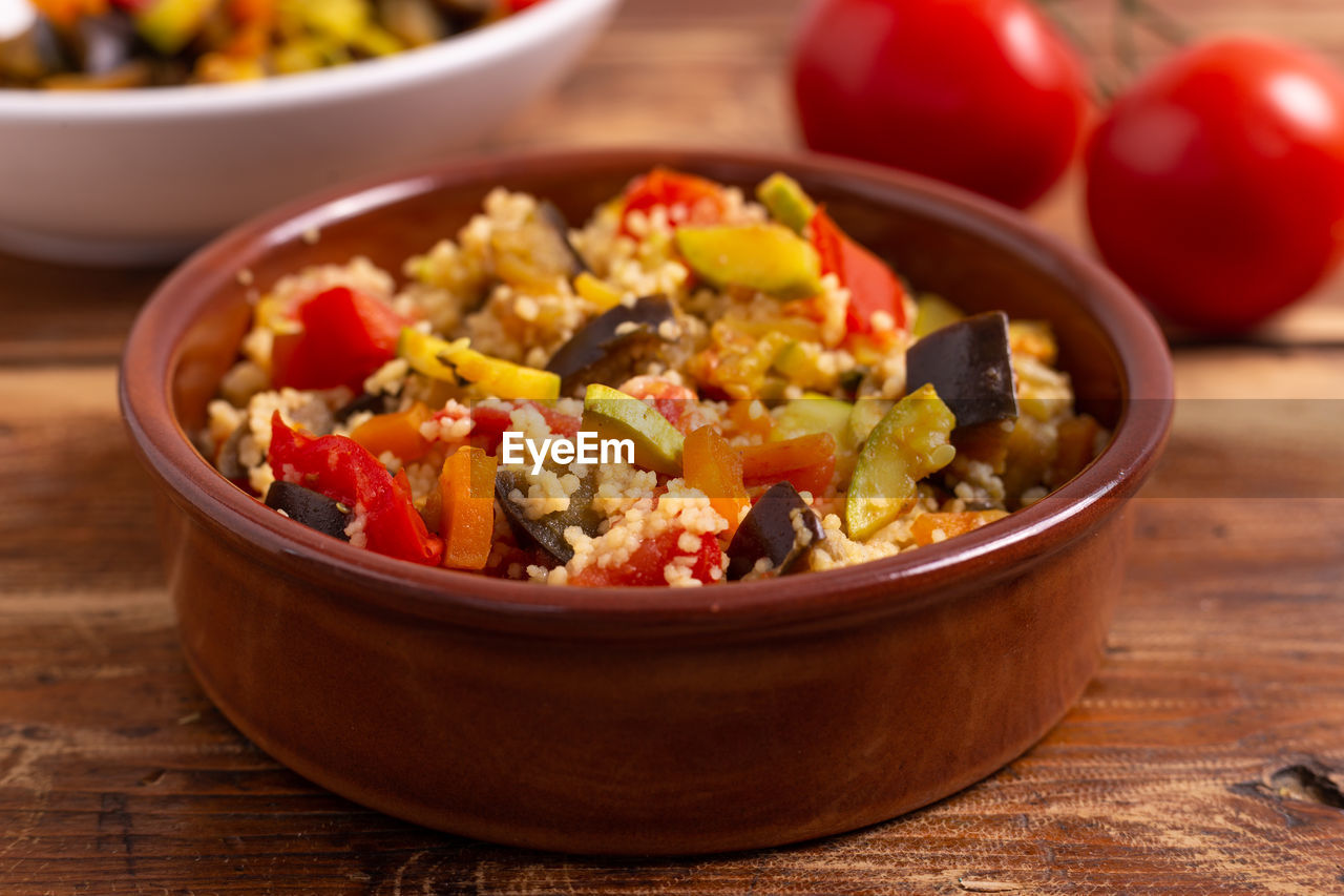 Close-up of cous cous salad in bowl on table