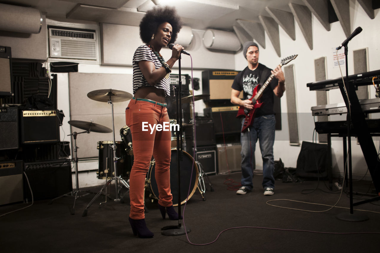 Musicians rehearsing in a recording studio