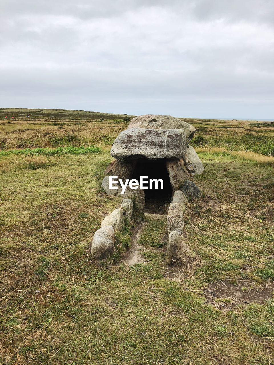 VIEW OF ROCK ON FIELD