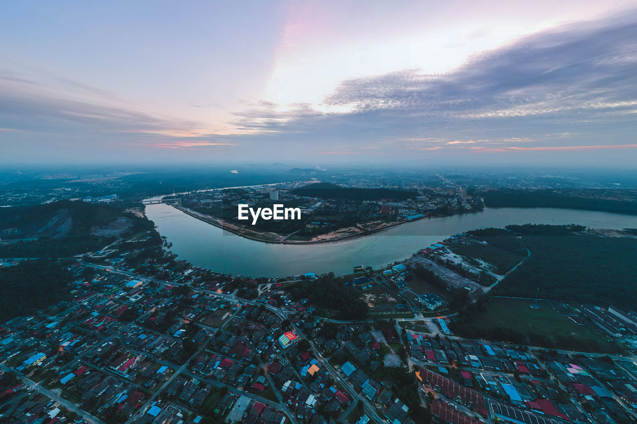 High angle view of buildings against sky during sunset