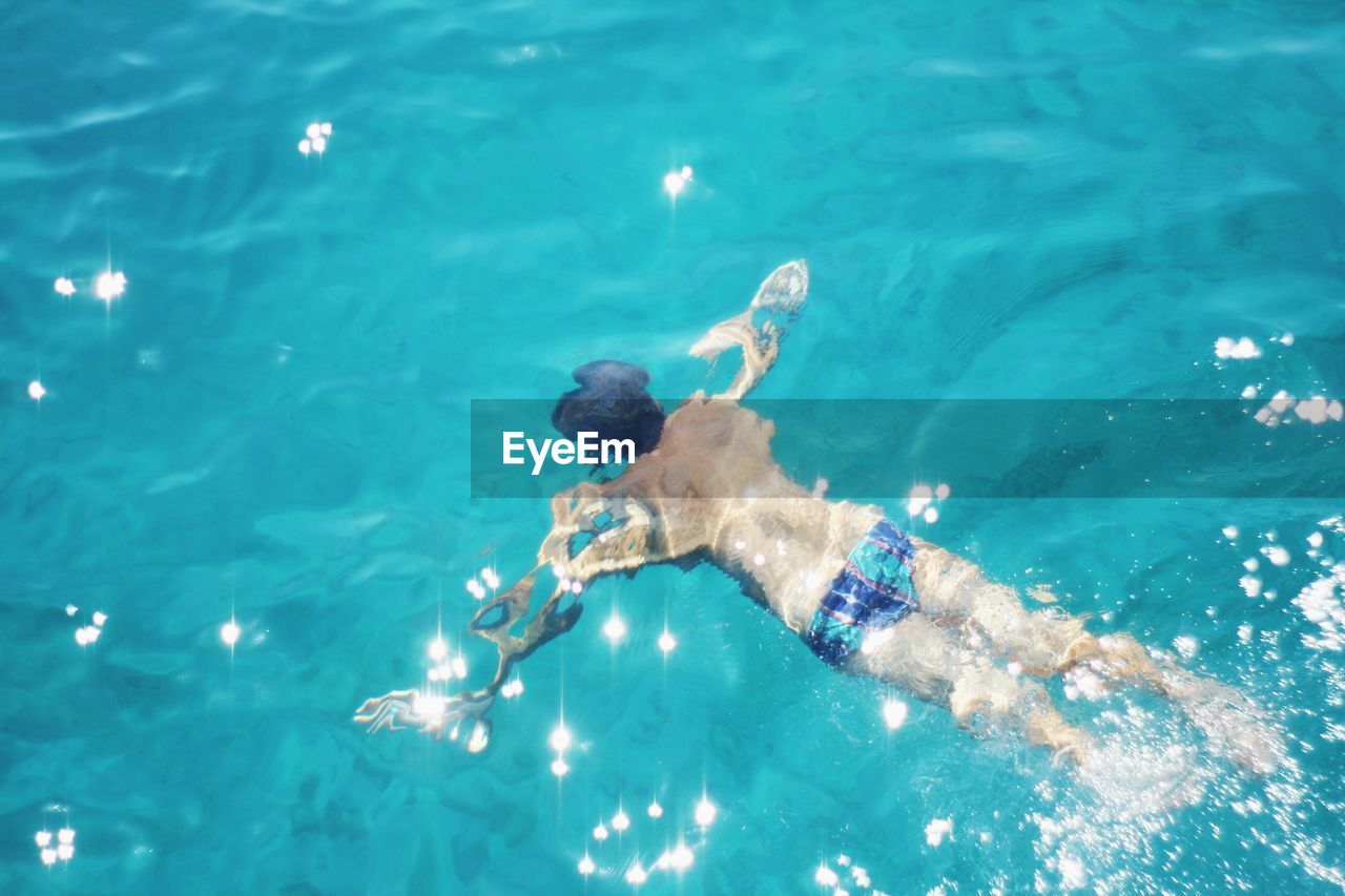 Man swimming in sea