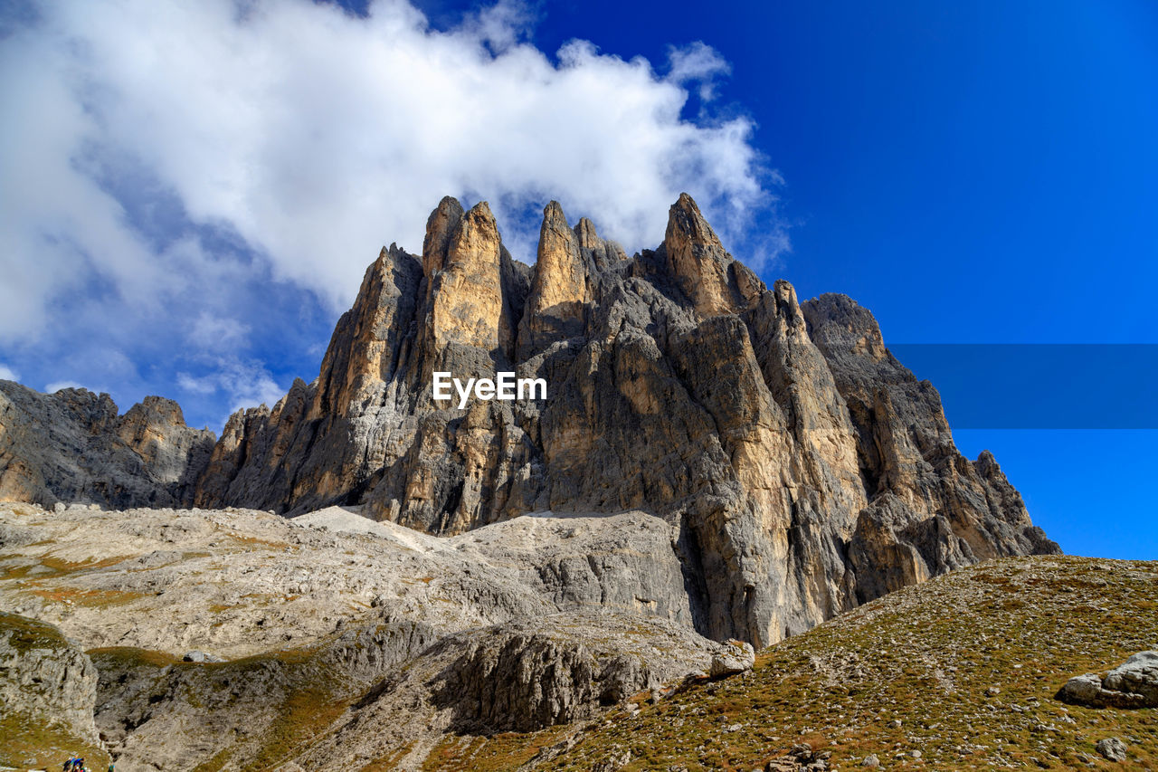 Low angle view of rock formations against sky