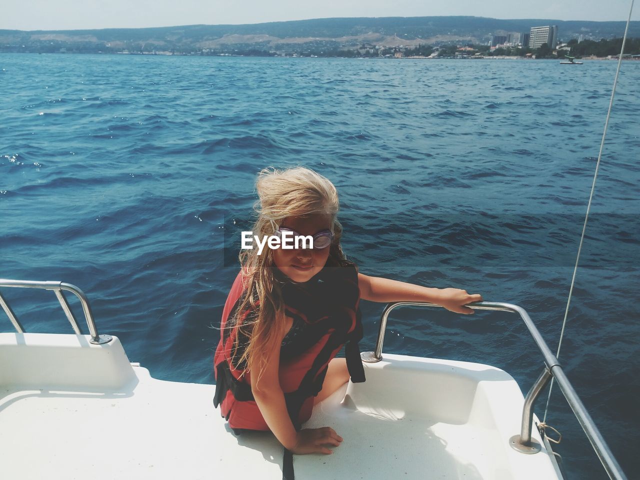 Girl sitting on yacht