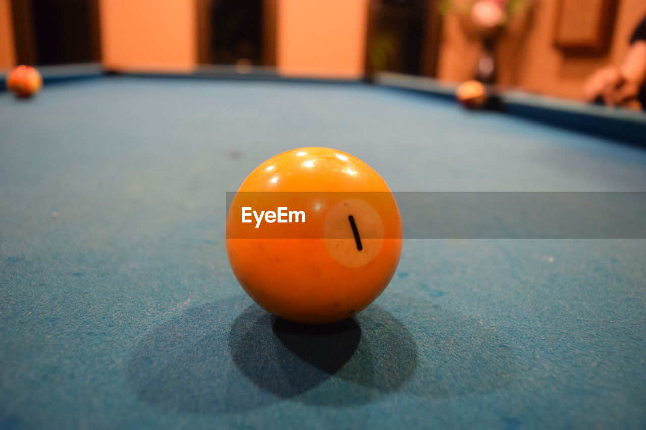 CLOSE-UP OF BALL ON TABLE AT HOME