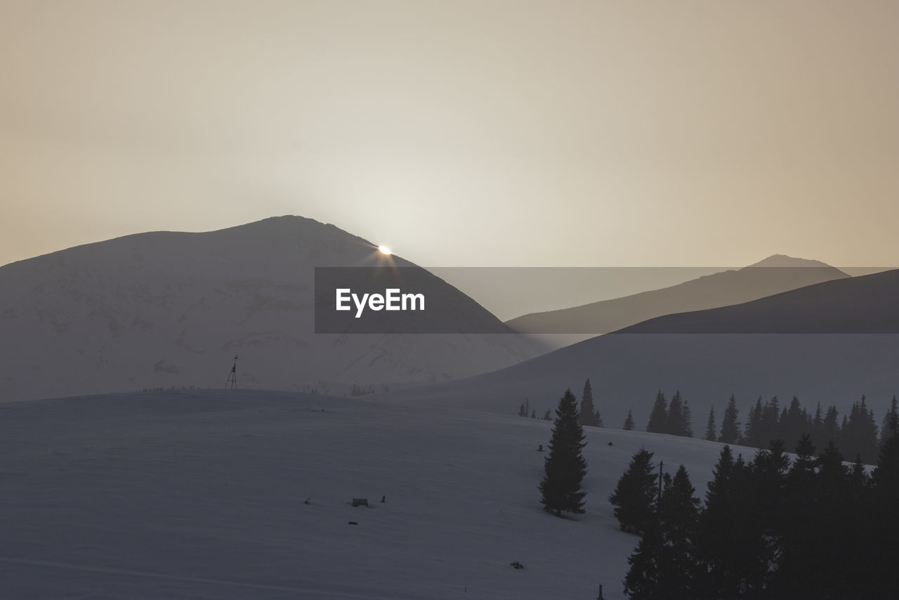 SCENIC VIEW OF MOUNTAINS AGAINST CLEAR SKY DURING WINTER