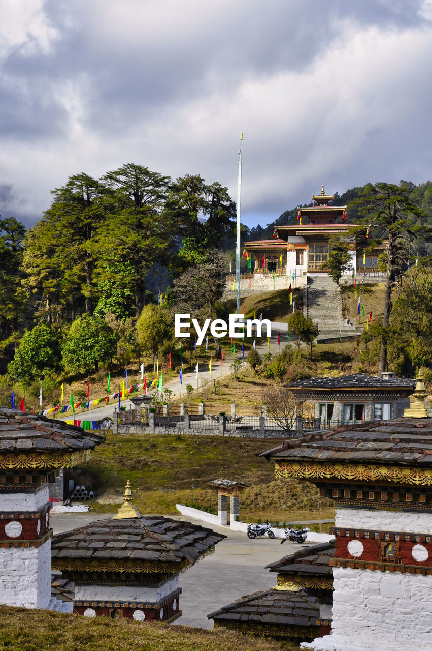 Buddhist temple aside the stupas of  dochula, a pass in the thimphu district, bhutan 