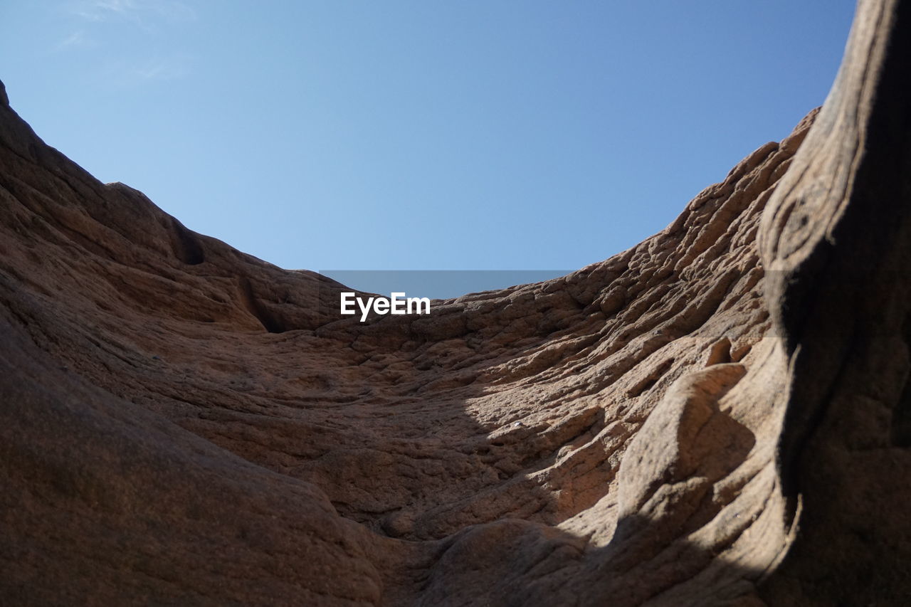 Scenic view of rocky mountains against clear sky