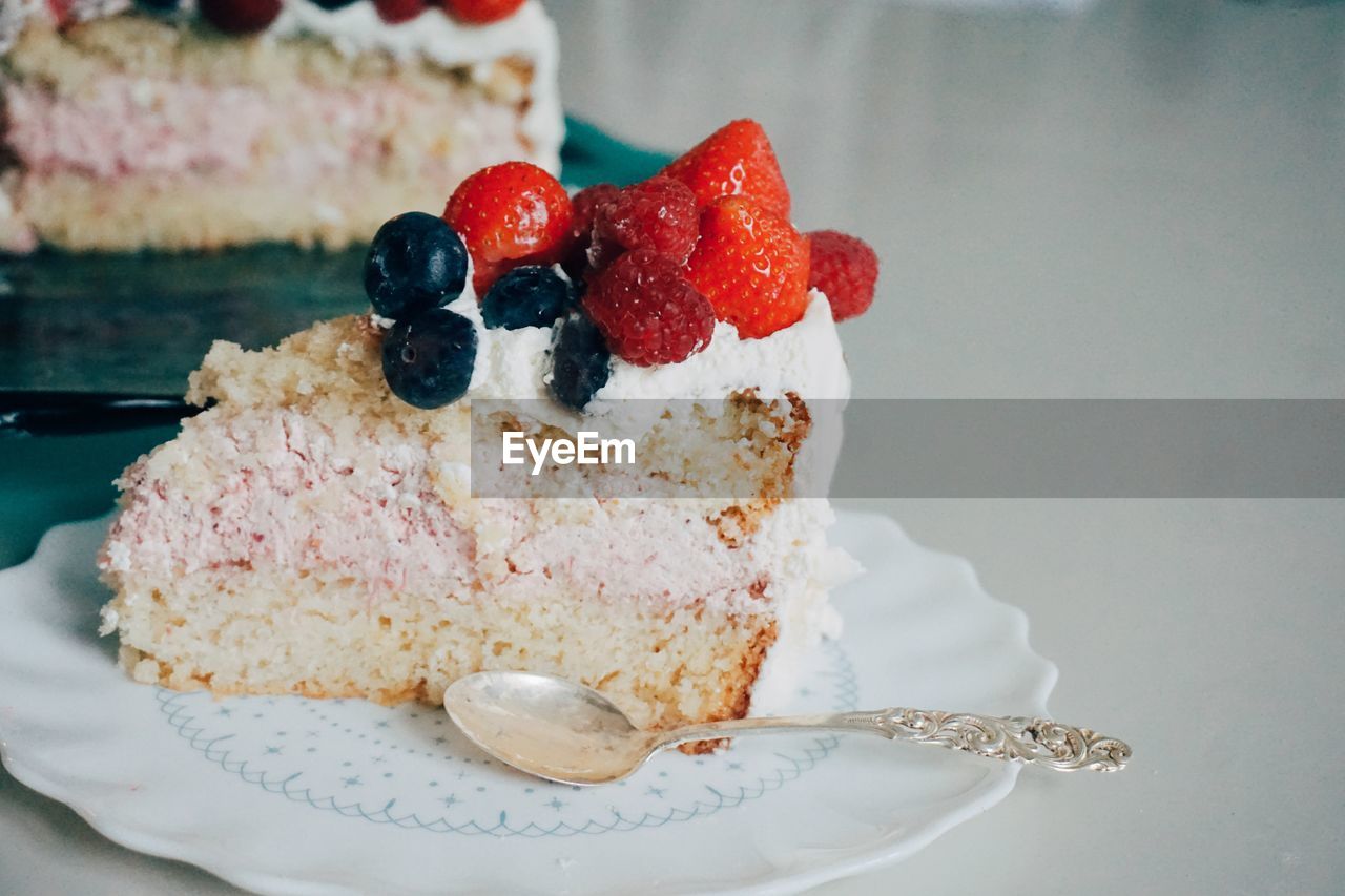 Close-up of fruitcake served in plate on table