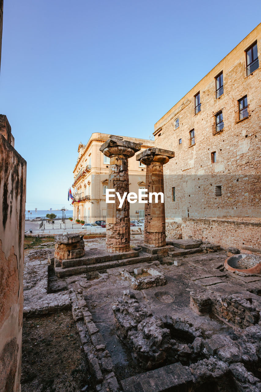 Greek columns from the temple of poseidon in taranto, vertical