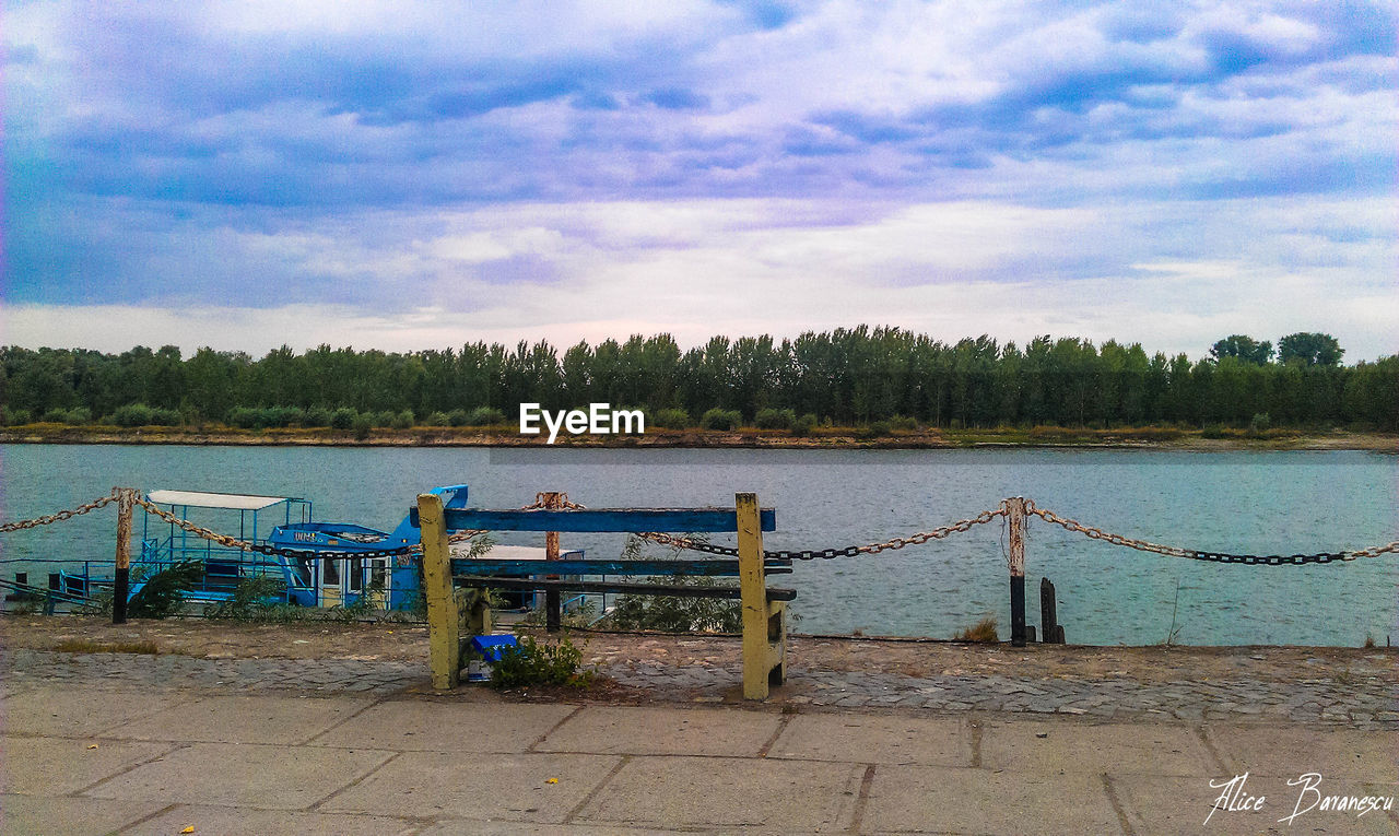 PIER OVER LAKE AGAINST SKY