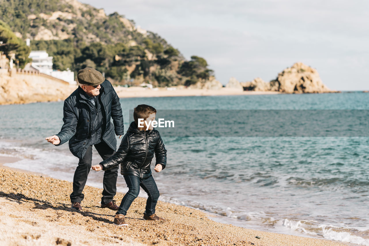 Full length of boys on beach