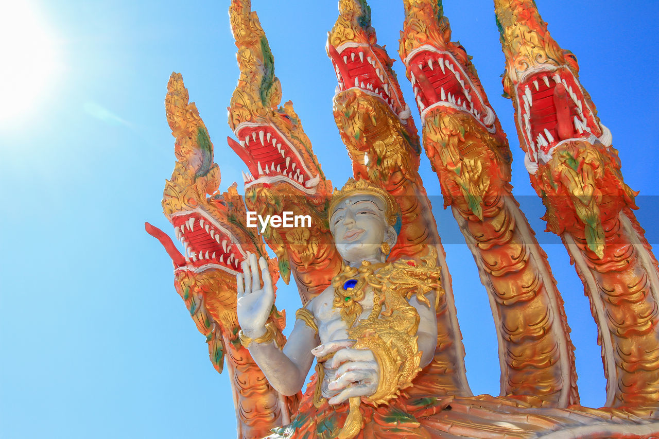 Low angle view of statue against sky