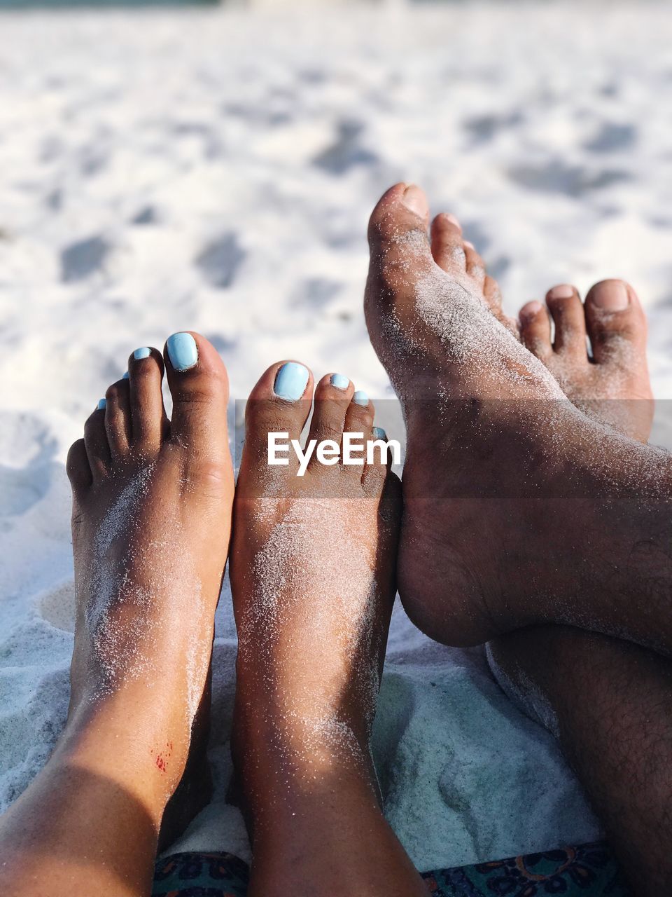 Low section of couple at beach