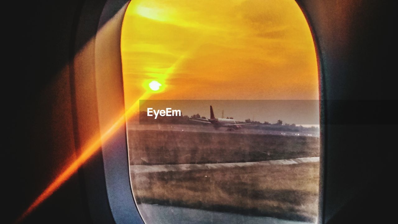 CLOSE-UP OF CITYSCAPE SEEN THROUGH WINDOW