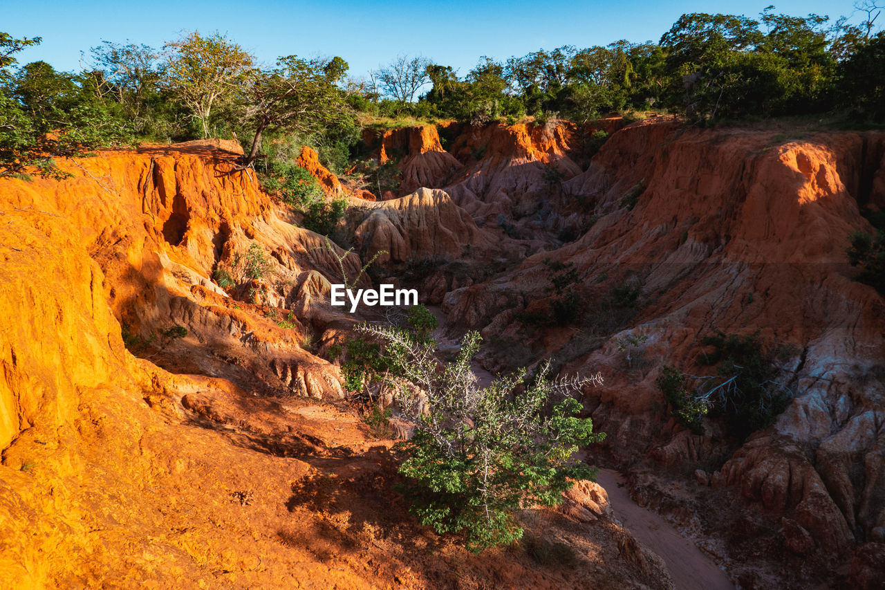 Scenic view of rock formations at marafa depression - hell's kitchen at sunset in malindi, kenya