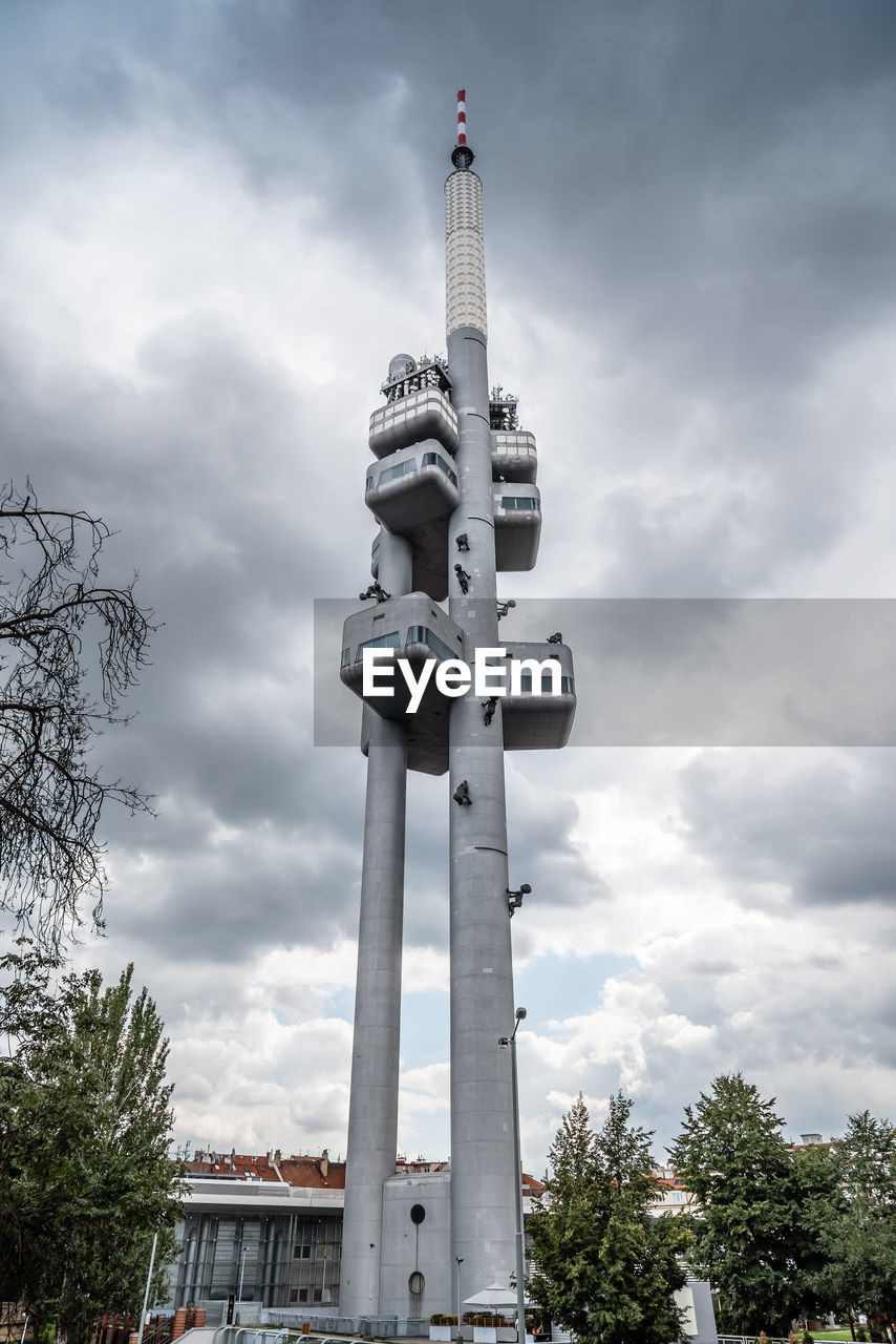 LOW ANGLE VIEW OF TOWER AND BUILDING AGAINST SKY