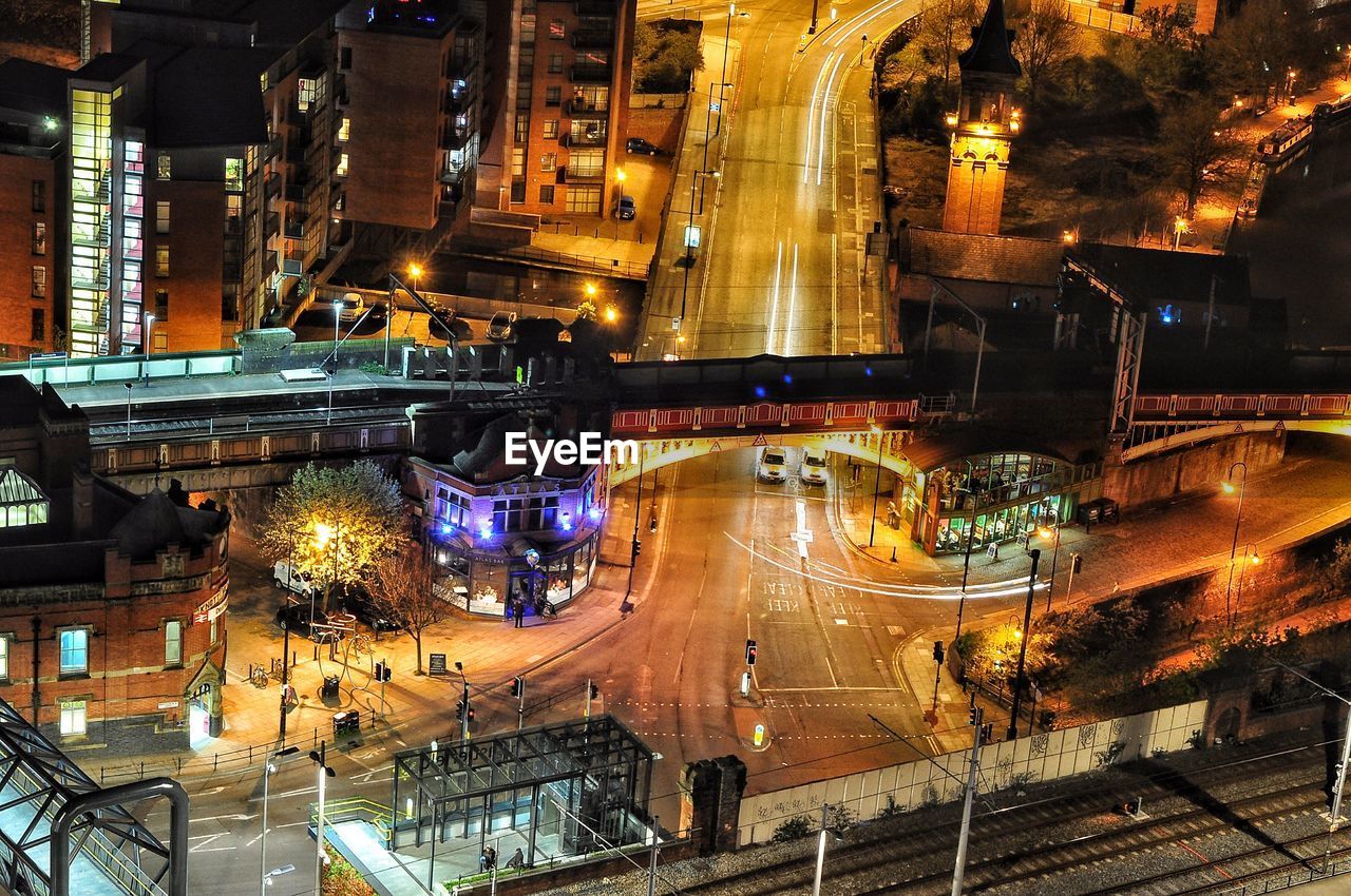 ILLUMINATED CITY STREET AT NIGHT