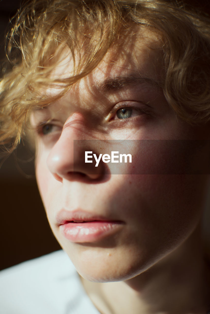 Close-up of young man looking away