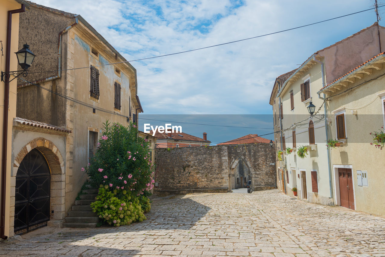 STREET AMIDST BUILDINGS IN TOWN