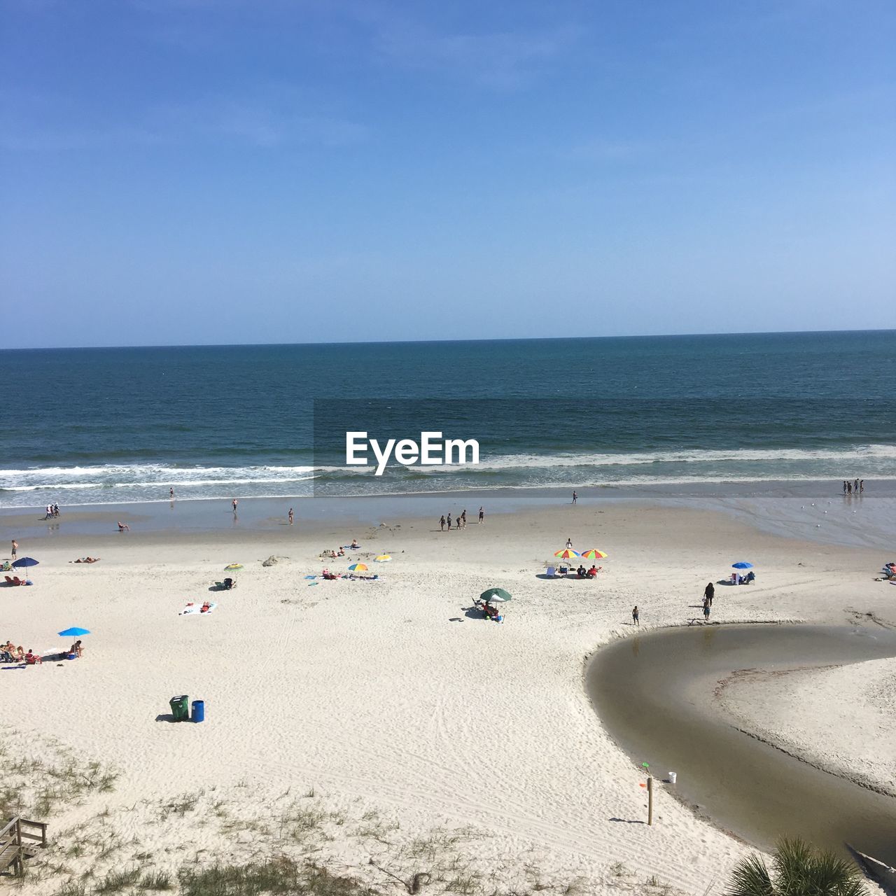 Scenic view of sea against blue sky