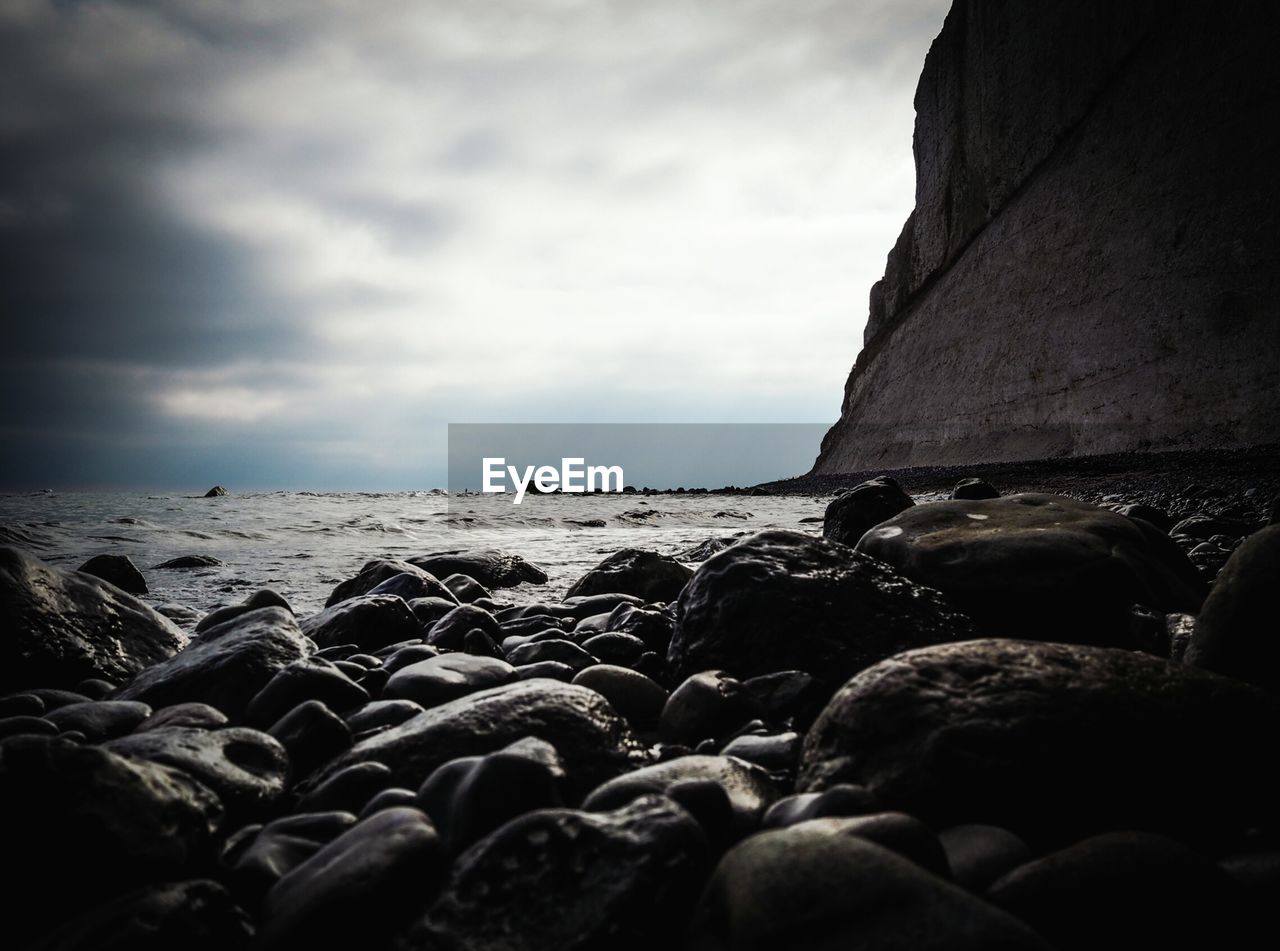 Scenic view of sea and rocks against sky