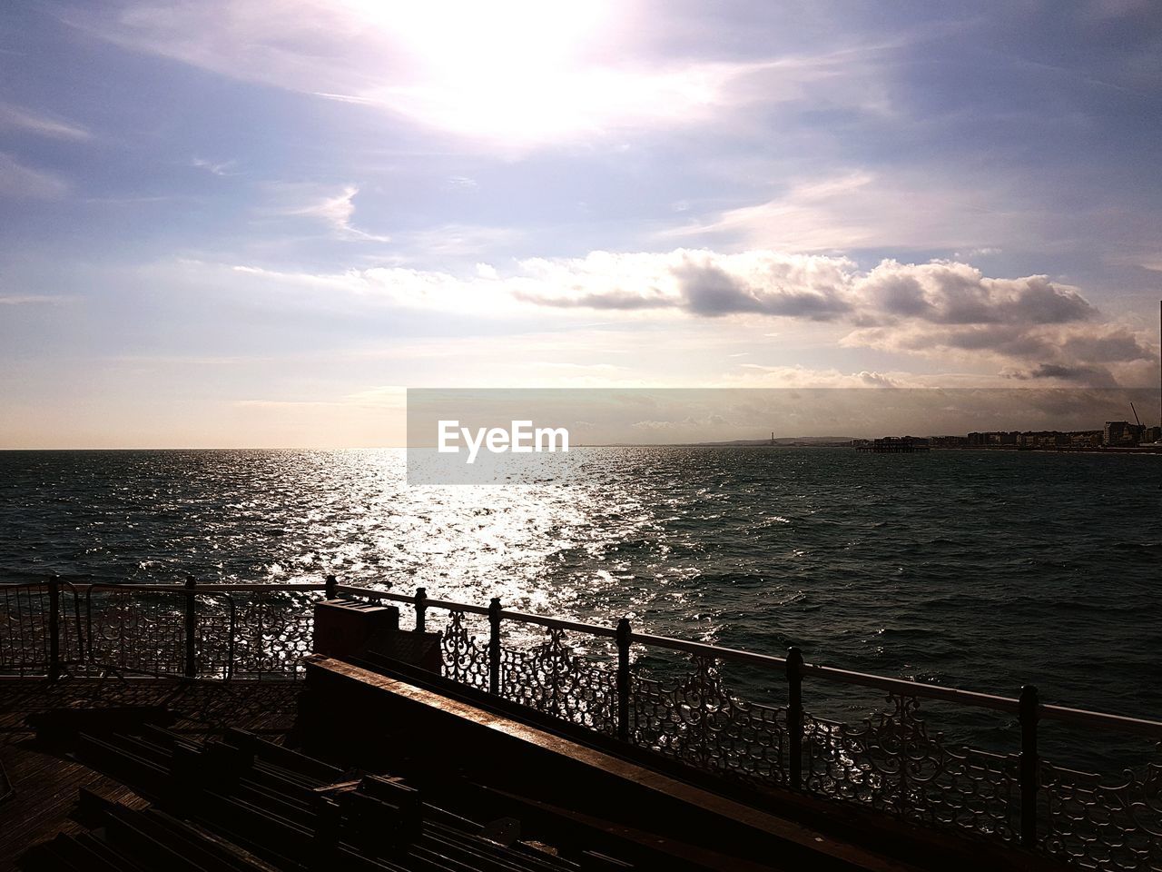 Scenic view of sea against sky on sunny day seen from brighton pier