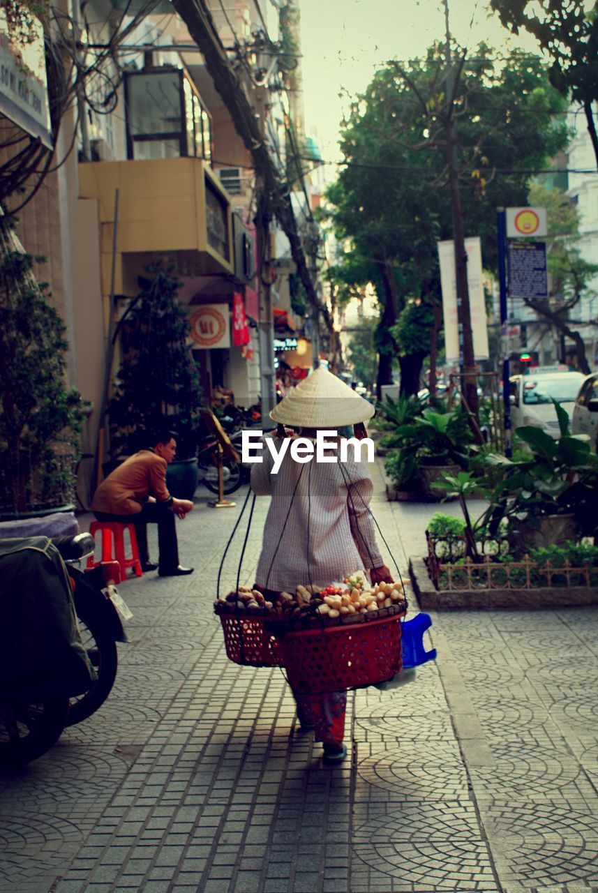 PEOPLE ON MARKET STALL