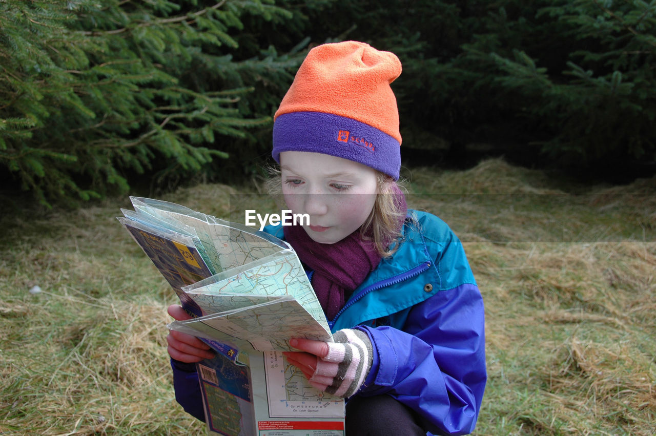 Close-up of a girl looking at map