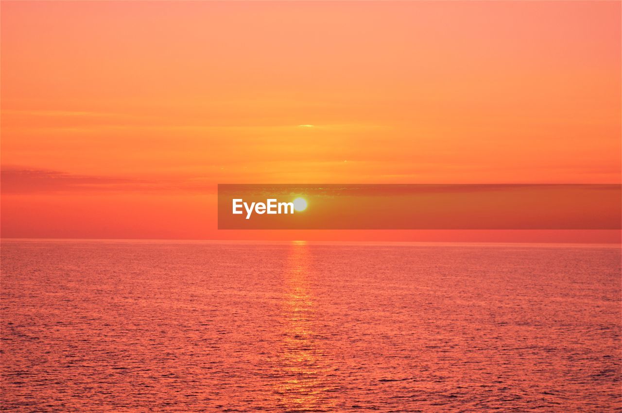 SCENIC VIEW OF SEA AGAINST ROMANTIC SKY