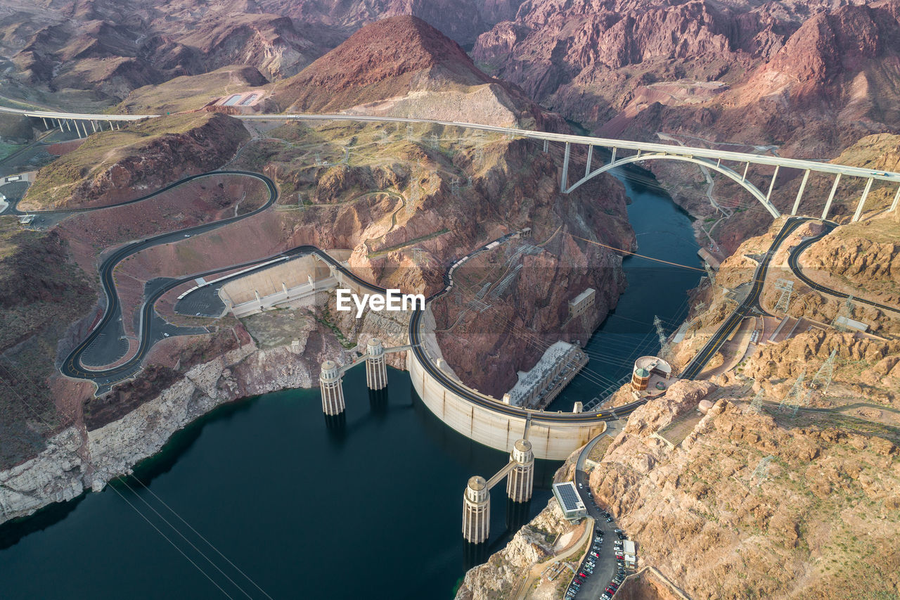 Hoover dam in nevada. mountain and colorado river in background.