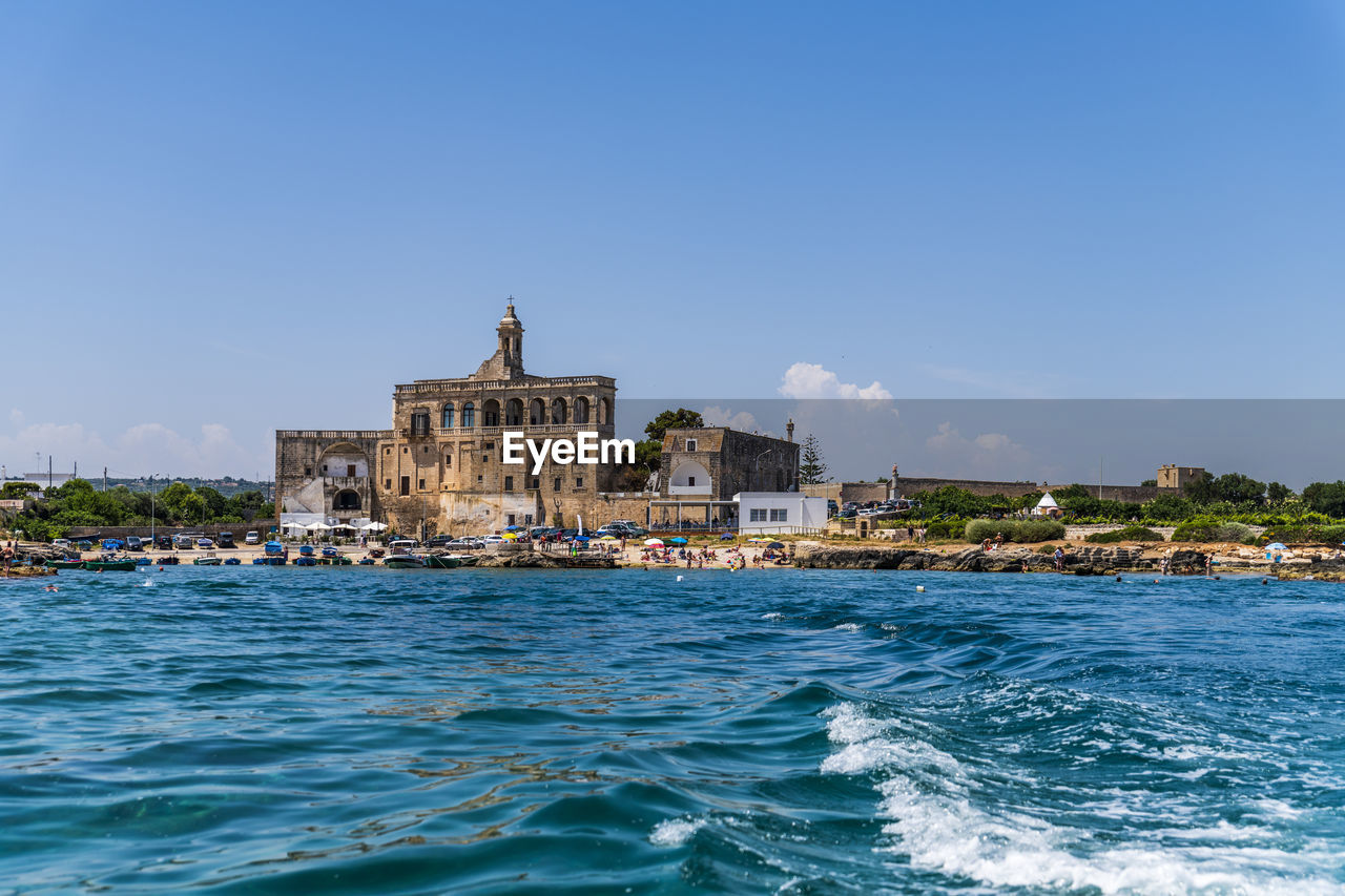 VIEW OF BUILDING BY SEA