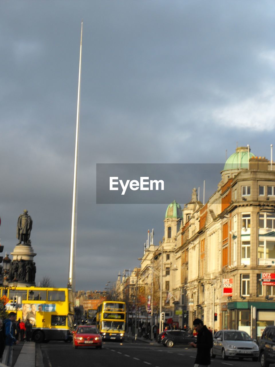 VIEW OF CITY AGAINST CLOUDY SKY