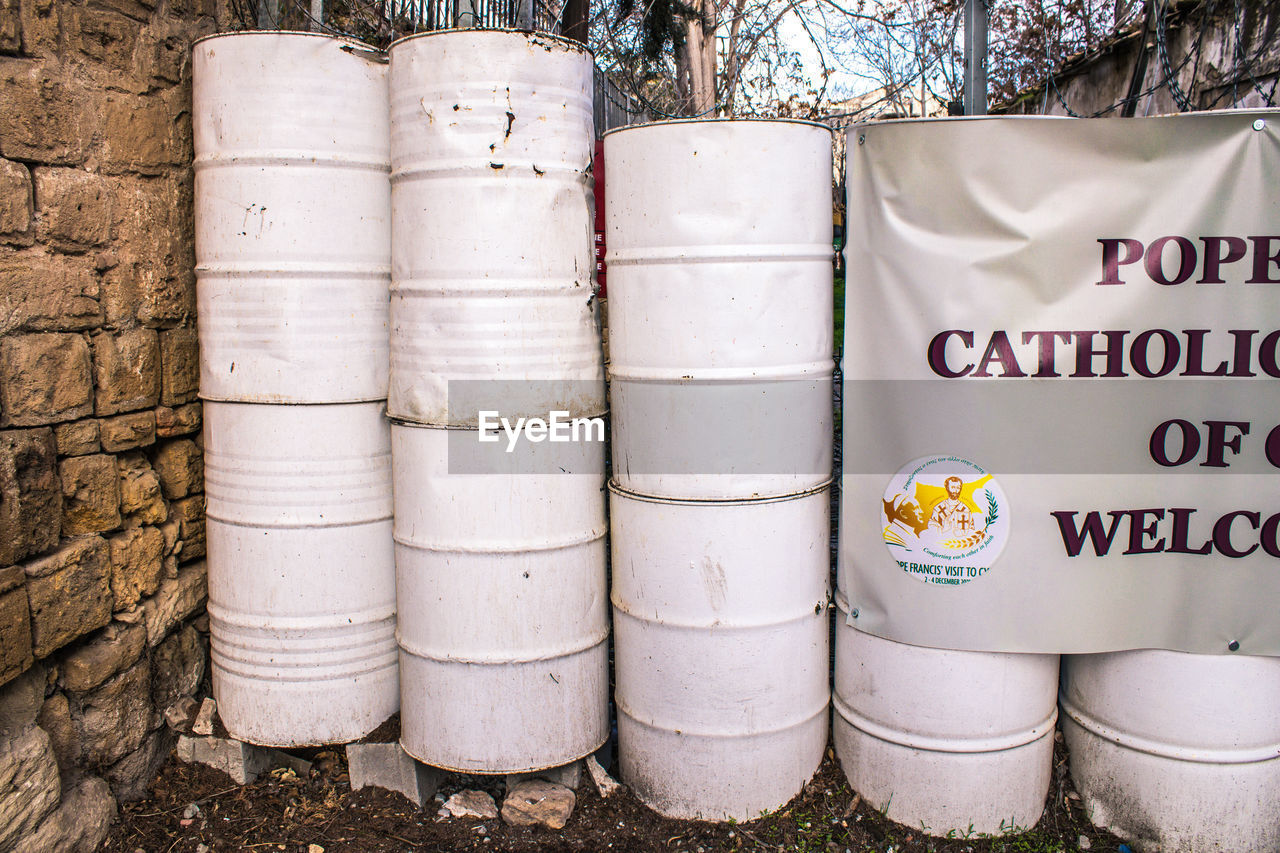 text, no people, western script, communication, food and drink, nature, day, cylinder, plant, barrel, container, outdoors