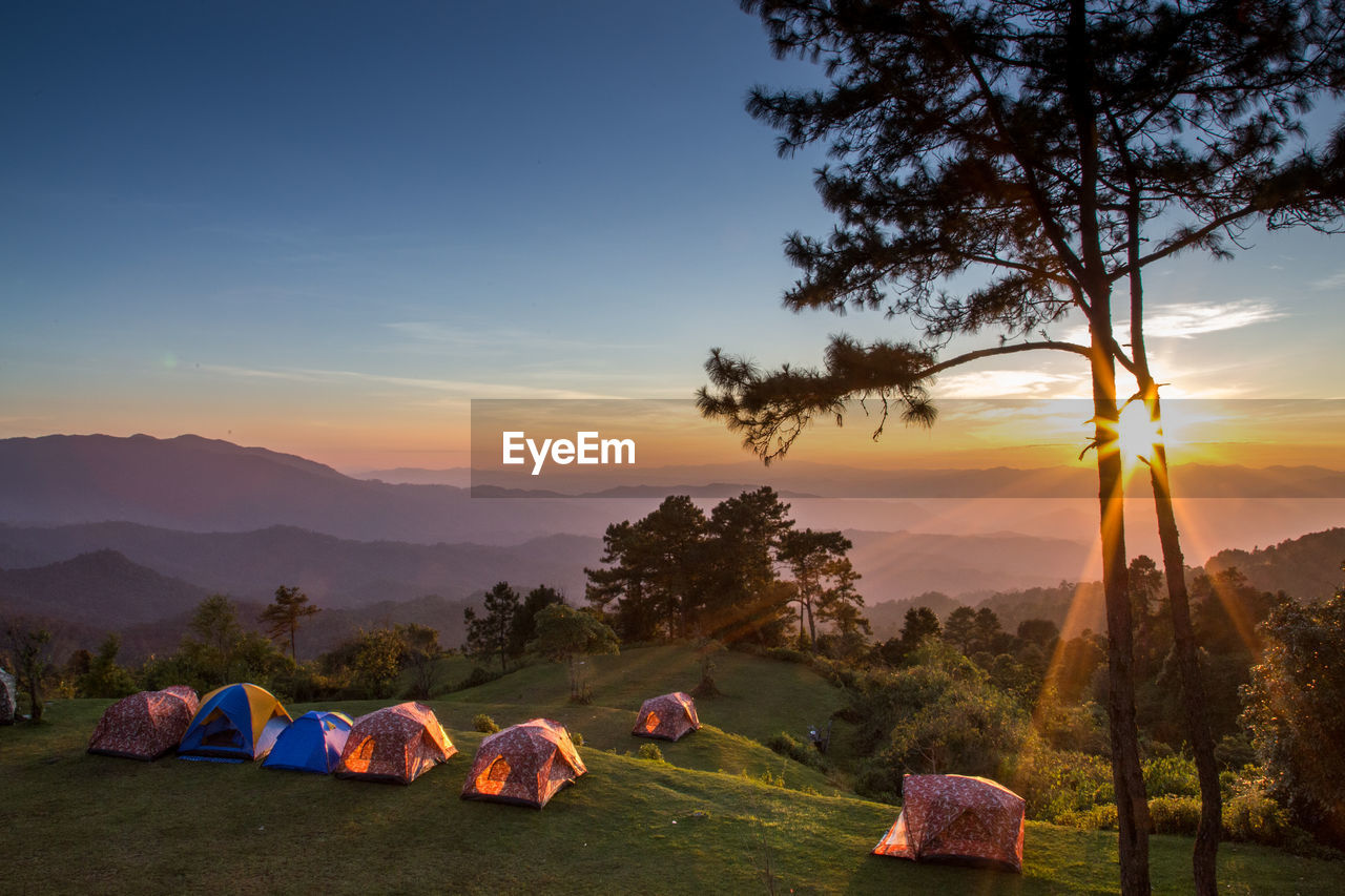 Tent on landscape against sky