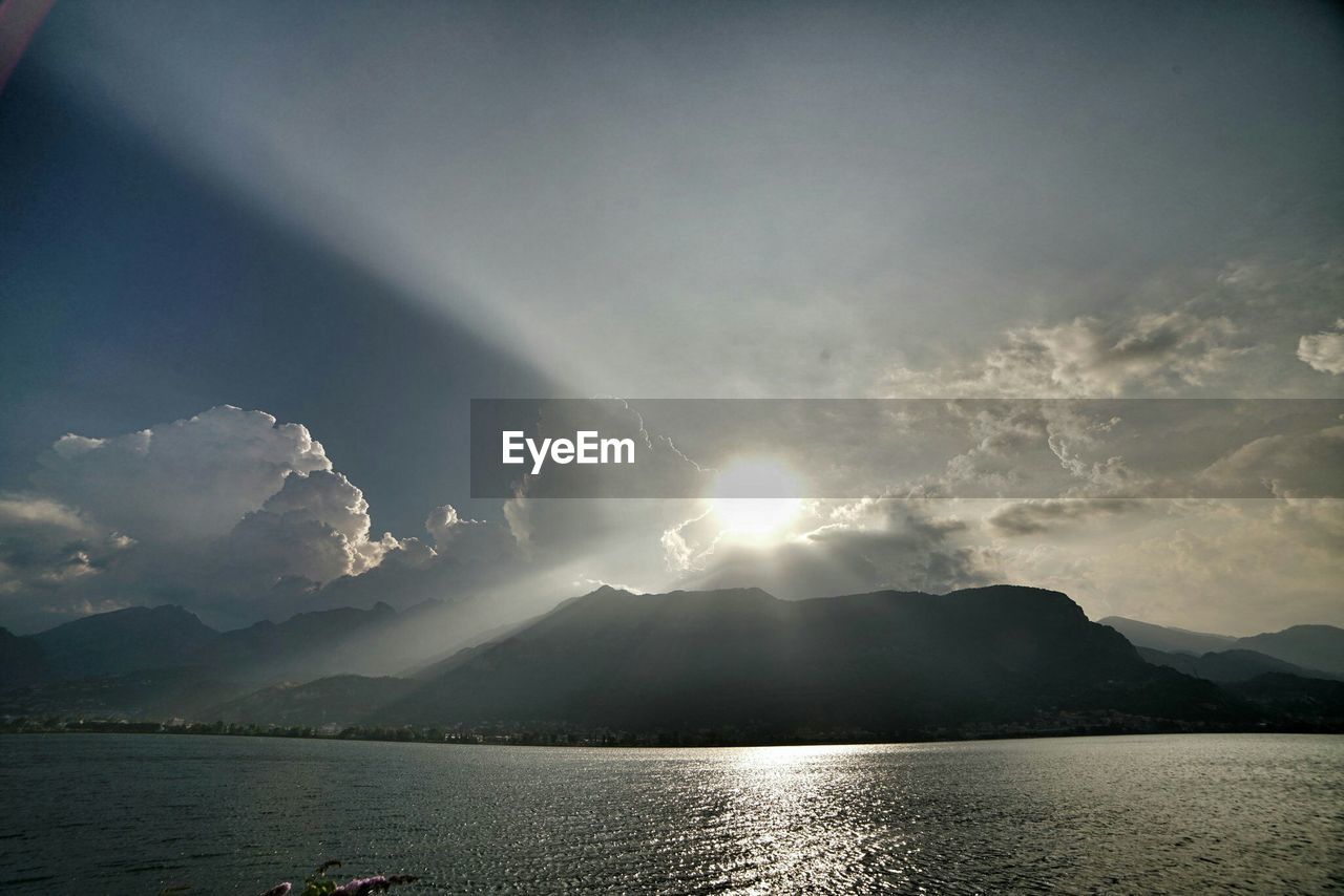 Scenic view of mountains against cloudy sky