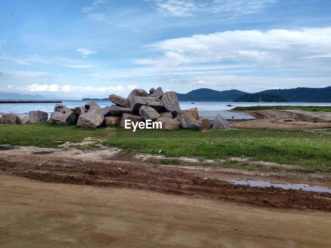 Rocks on beach against sky