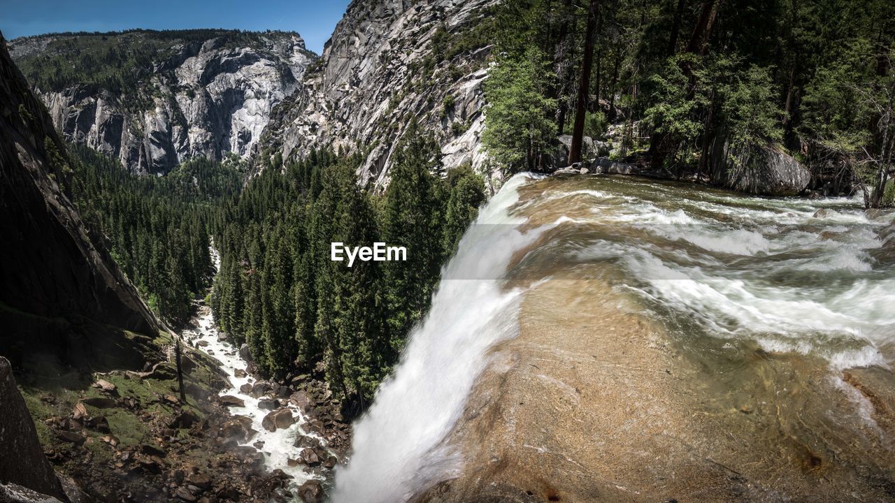 Scenic view of waterfall in forest