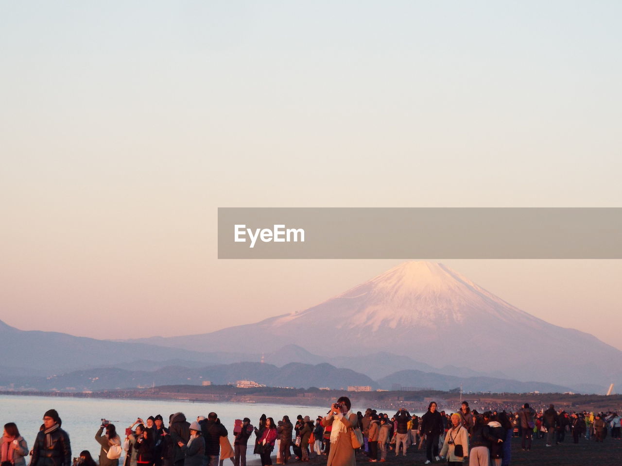 People at mount fuji against sky