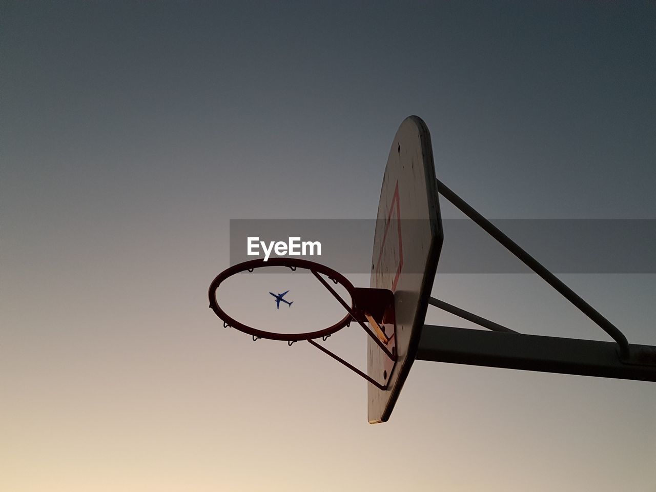 Low angle view of basketball hoop against clear sky