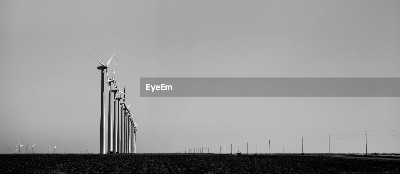 LOW ANGLE VIEW OF WIND TURBINE AGAINST SKY