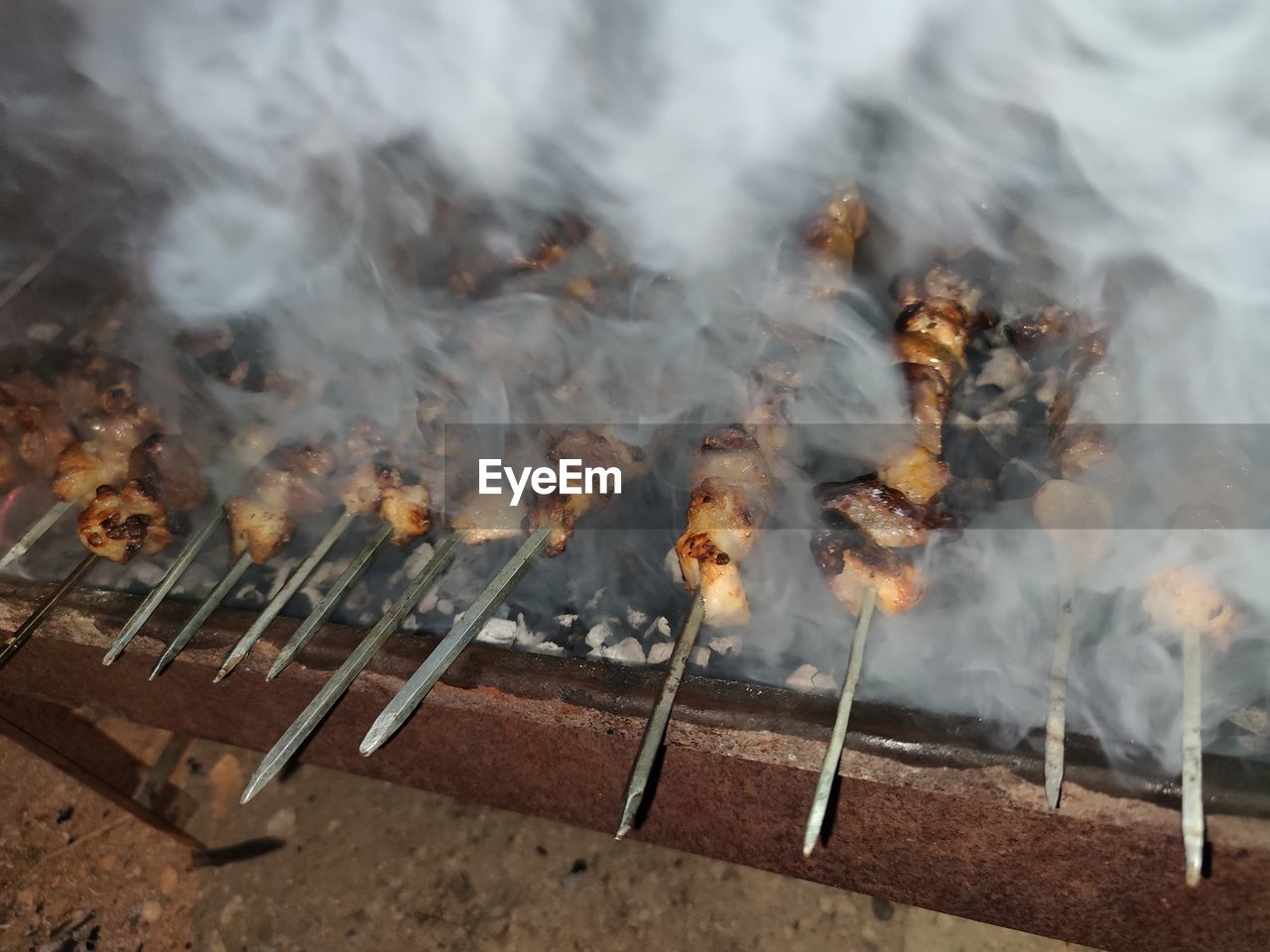 High angle view of bonfire on barbecue grill