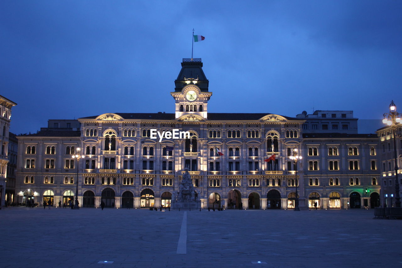 BUILDING AGAINST SKY AT NIGHT