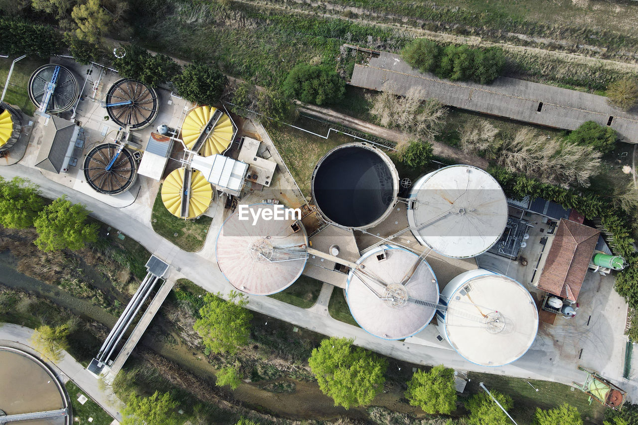 HIGH ANGLE VIEW OF BICYCLE AMIDST PLANTS IN ROW